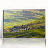 Modern art wall decor featuring a serene Palouse landscape, in muted greens and blues, acrylic print framed in white.
