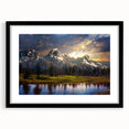 Colorful abstract art print of the Grand Tetons, in a black frame with mat, ideal for living room decor.