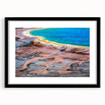 Abstract art print of Yellowstone scenery in vibrant colors on a large framed canvas, suitable for living room decor.