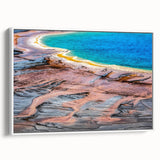 Vintage poster art of Yellowstone scenery on framed canvas with colorful palette, ideal for living room decor.