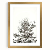 Abstract winter-themed textured art print in gold frame, featuring cool blue and white tones.