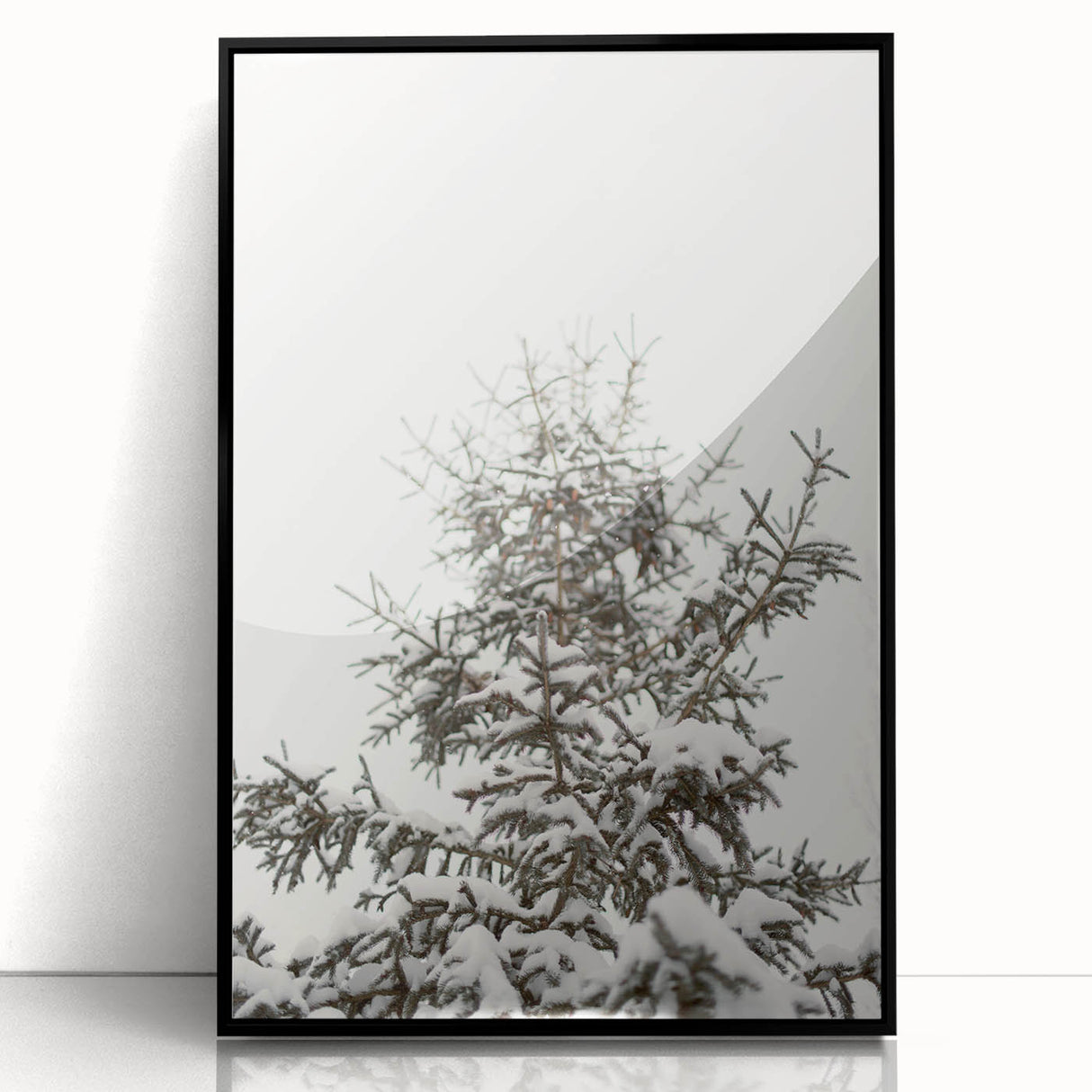 Large abstract wall art featuring winter-themed shapes in black and white, framed in acrylic.