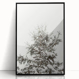 Large abstract wall art featuring winter-themed shapes in black and white, framed in acrylic.