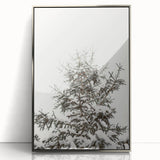 Mid-century modernist art depicting a winter scene with muted blue and silver tones on a framed acrylic.