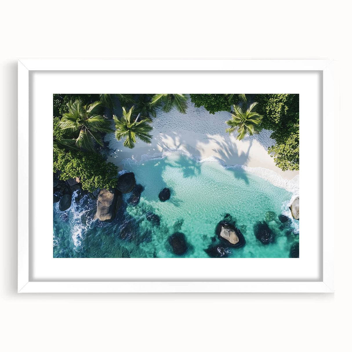 Framed landscape artwork depicting a serene beach scene with gentle waves and a clear blue sky, encased in a white mat, ideal for home decor.