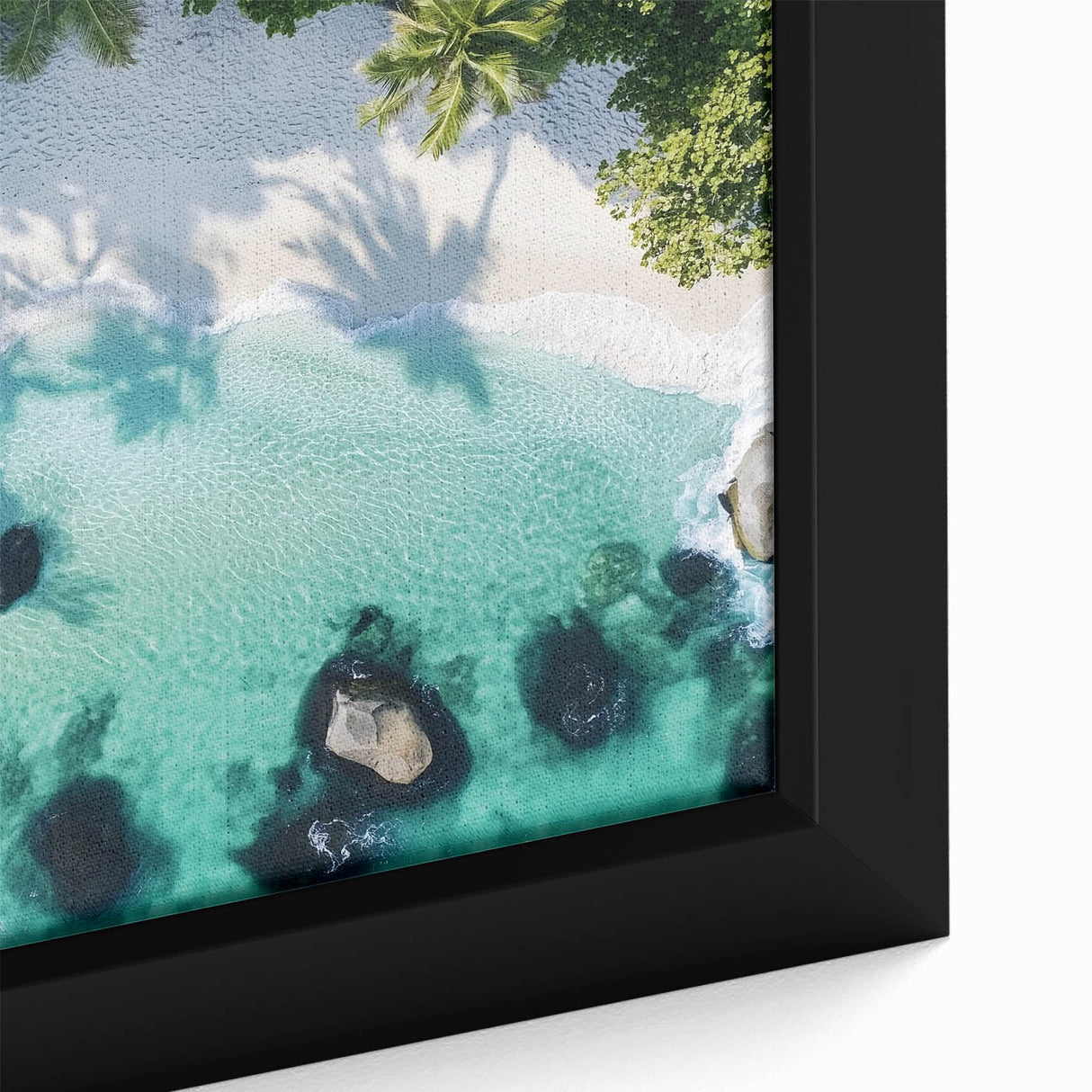 Framed canvas artwork showcasing a vibrant beach landscape with blue skies and golden sand, ideal for home decor and enhancing coastal-themed interiors.