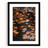 Abstract art print featuring a textured fall scene in vibrant orange and red hues on a large framed canvas.
