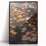 Large abstract wall art depicting autumnal trees in red and orange hues, framed in black acrylic.