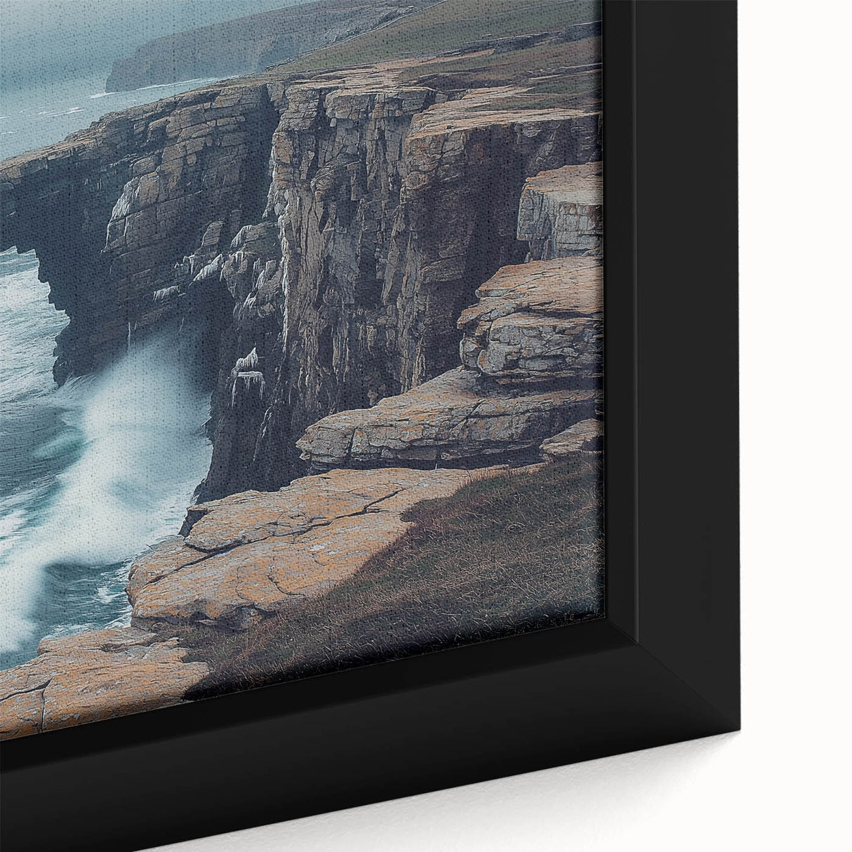 Close-up of a framed canvas depicting a stunning landscape with dramatic cliffs and vibrant colors, ideal for enhancing home decor and adding natural beauty.