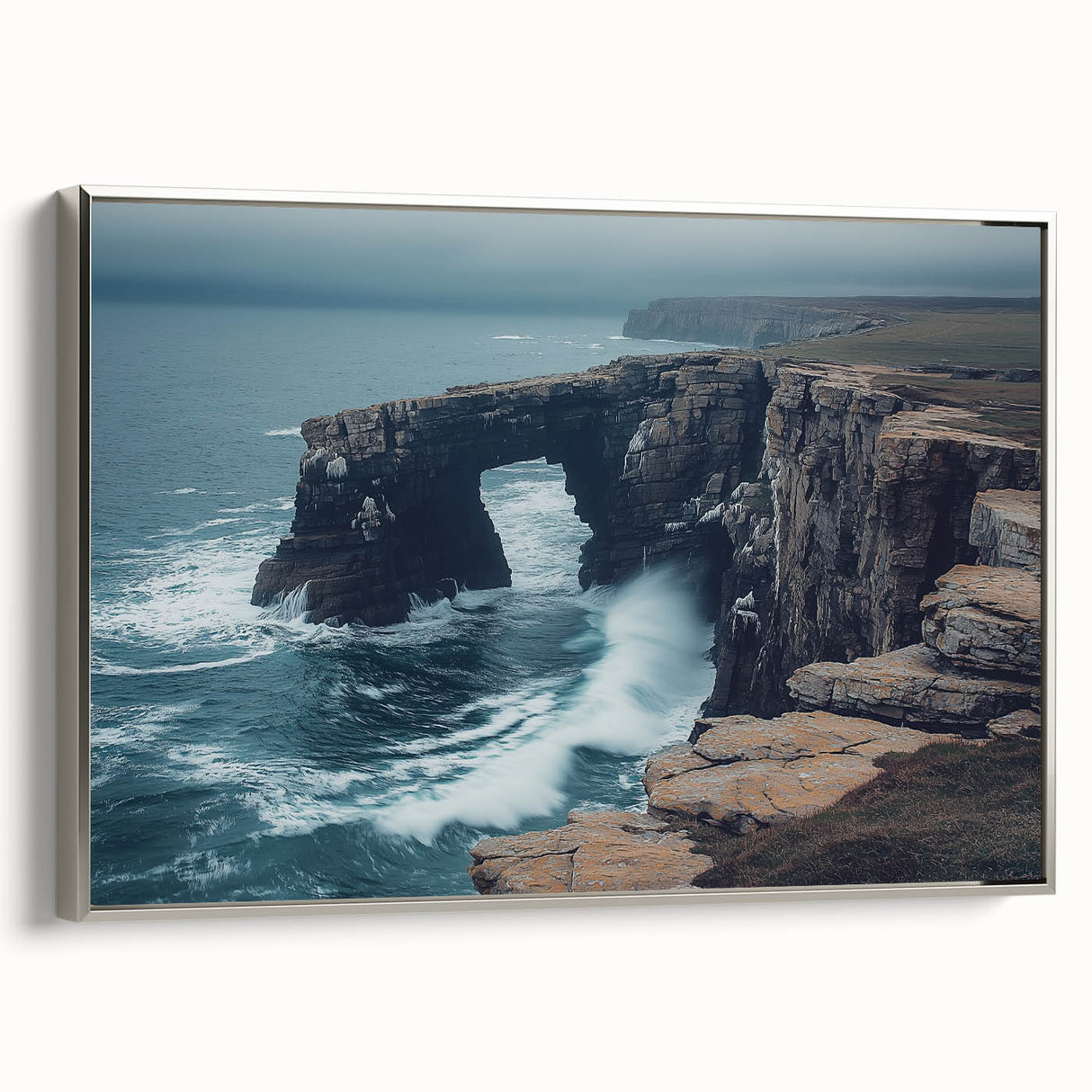 Framed canvas artwork depicting a stunning cliff landscape, featuring vibrant colors and intricate details, accented with a sleek silver frame for an elegant display. Ideal for modern home decor.