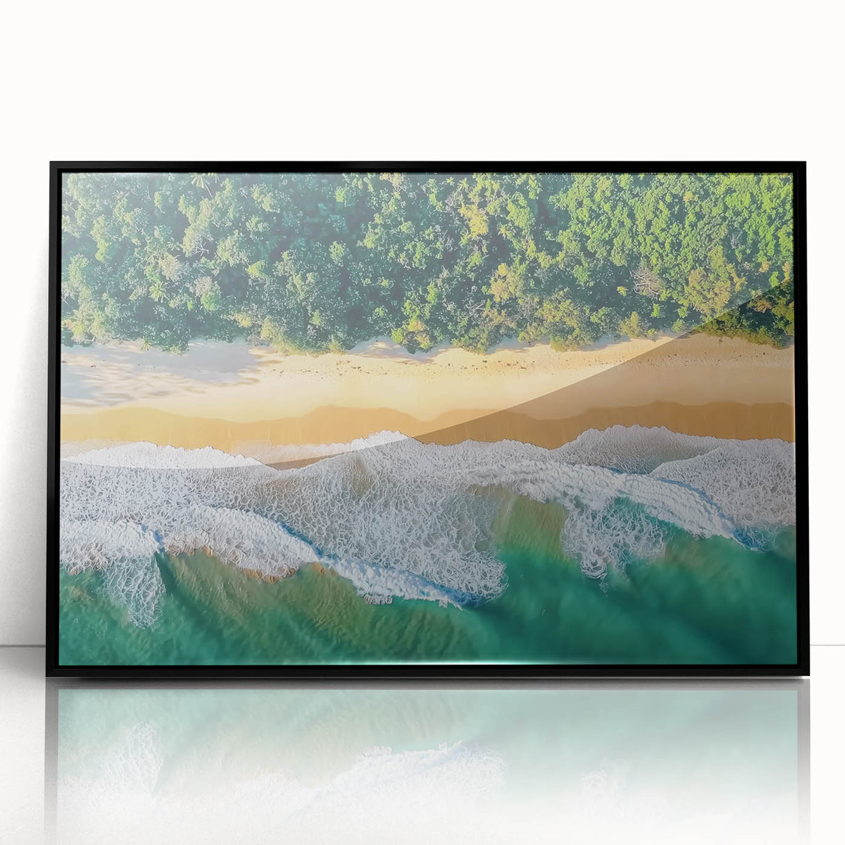Framed acrylic artwork showcasing a serene beach landscape with gentle waves and a clear blue sky, set in a sleek black frame for modern decor. Ideal for coastal-themed interiors.