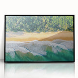Framed acrylic artwork showcasing a serene beach landscape with gentle waves and a clear blue sky, set in a sleek black frame for modern decor. Ideal for coastal-themed interiors.