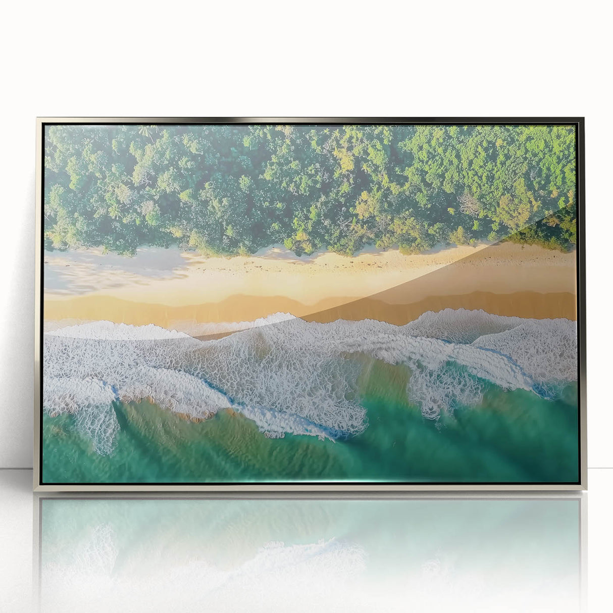 Framed acrylic artwork depicting a serene beach landscape with gentle waves and a vibrant sunset, featuring silver frame accents, ideal for modern home decor.