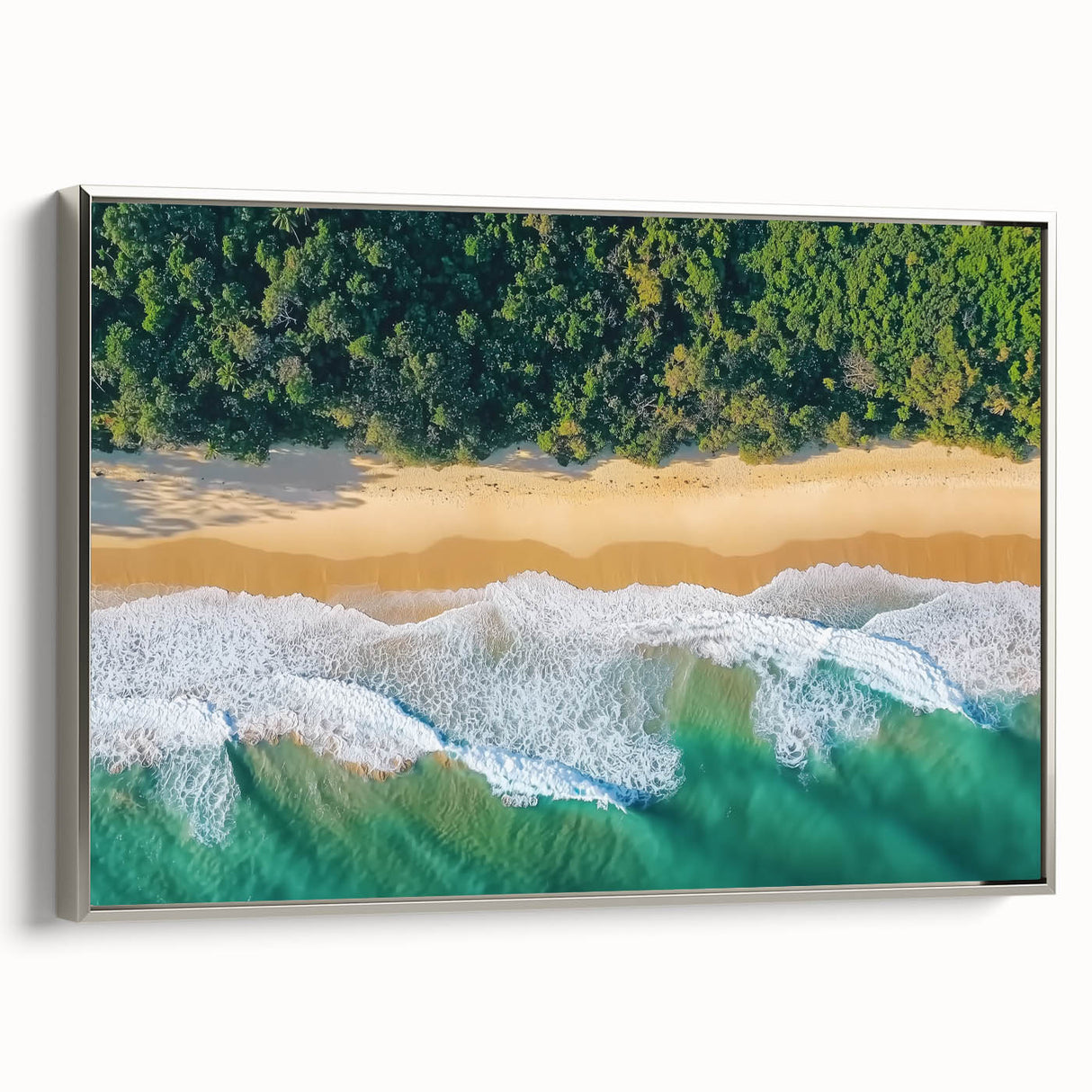 Framed canvas artwork showcasing a stunning beach landscape with vibrant colors, displayed from a side view against a silver frame, perfect for home decor.