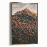 Framed canvas depicting a vintage-style landscape with autumn trees in muted gold and black, ideal for bedroom wall decor.