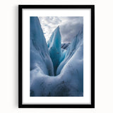 Framed landscape artwork showcasing a dramatic cliffside view, presented in a sleek black frame with a white mat, perfect for enhancing modern decor.
