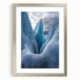 Framed landscape artwork depicting majestic cliffs in a silver mat, showcasing nature's beauty with vibrant colors, perfect for home decor.