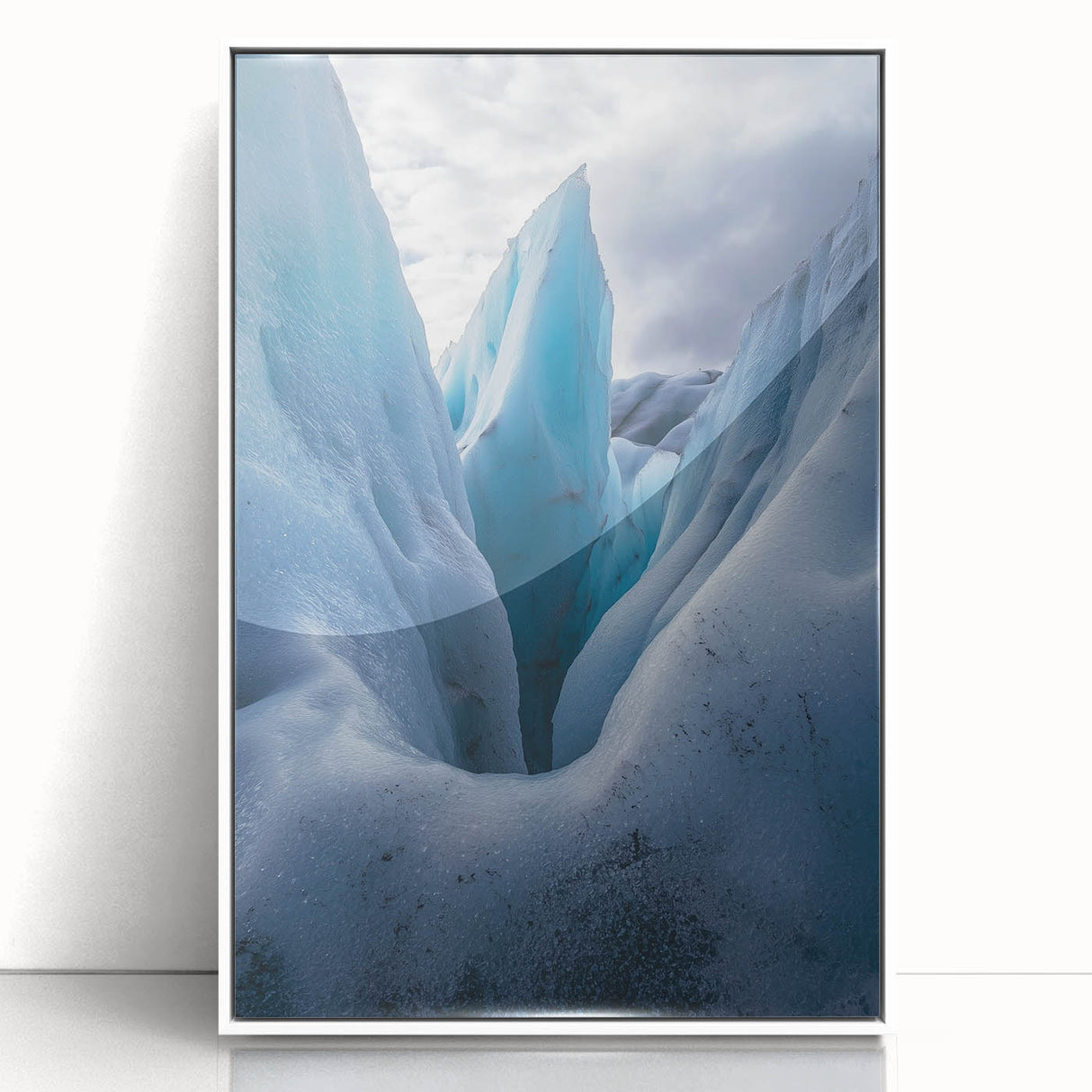 Framed acrylic artwork depicting a scenic landscape of dramatic cliffs under a vibrant sky, featuring a white frame that enhances the visual appeal, ideal for modern decor.