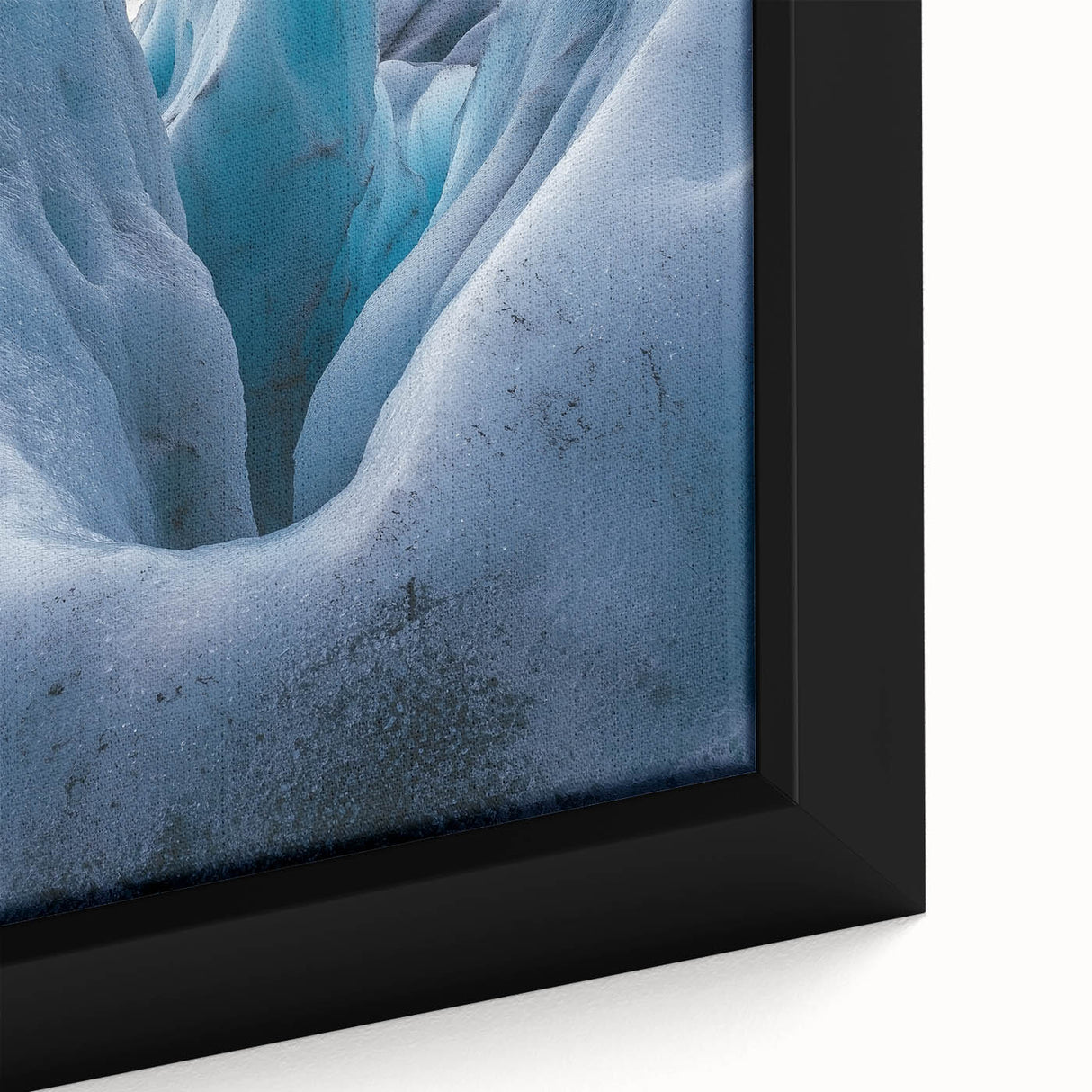 Close-up of a framed canvas depicting vibrant landscapes with dramatic cliffs, showcasing rich colors and textures, perfect for enhancing home decor.