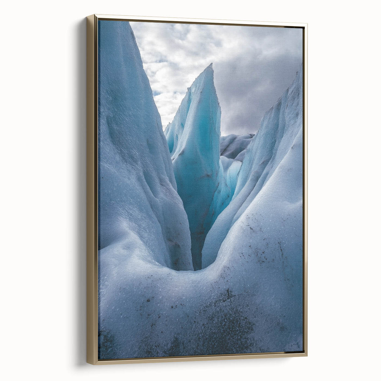 Framed canvas artwork showcasing a stunning landscape with dramatic cliffs, highlighted by a gold frame. Perfect for enhancing modern home decor and adding elegance.