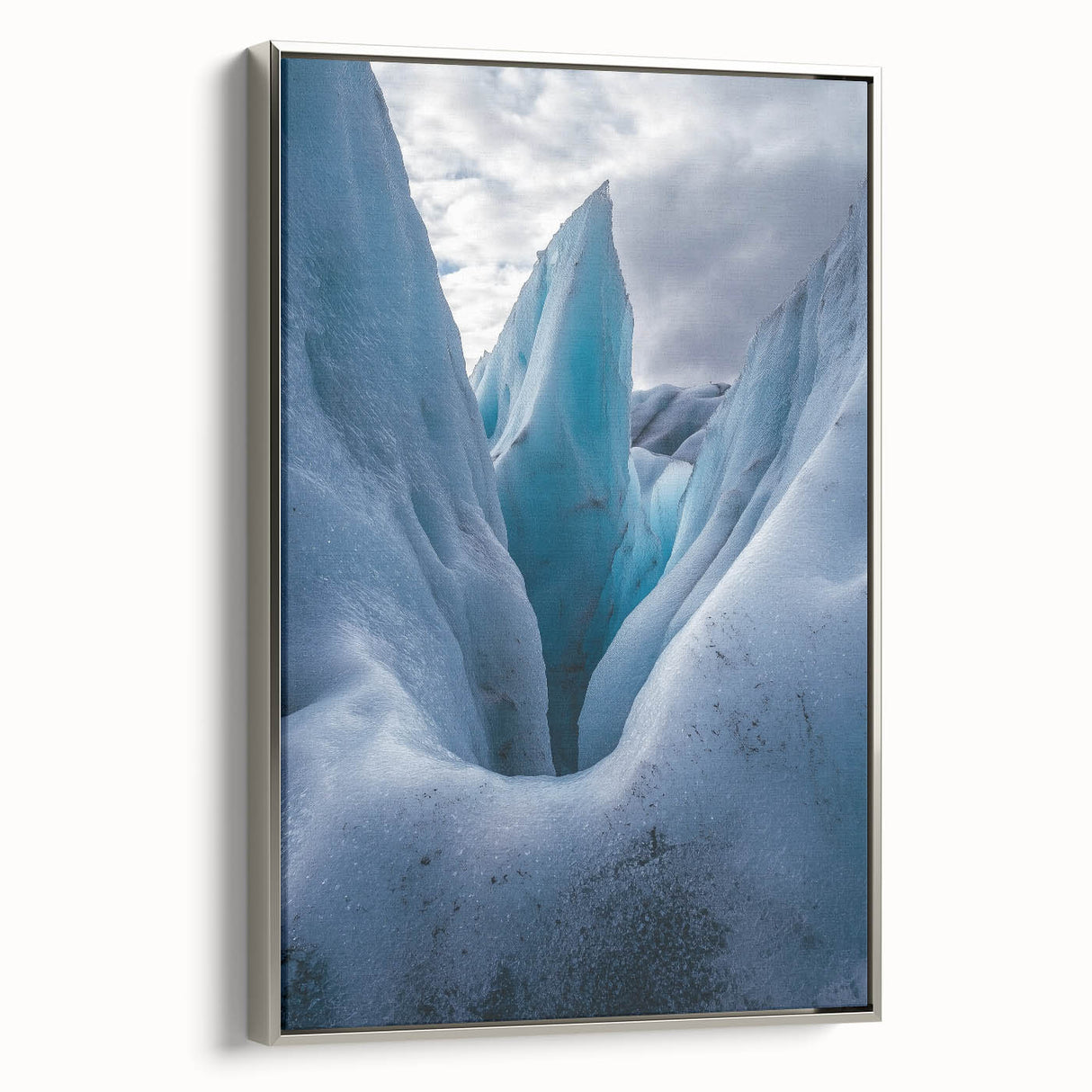 Framed canvas artwork depicting a stunning landscape of cliffs, highlighted by silver accents, showcasing intricate details and vibrant colors, perfect for home decor.