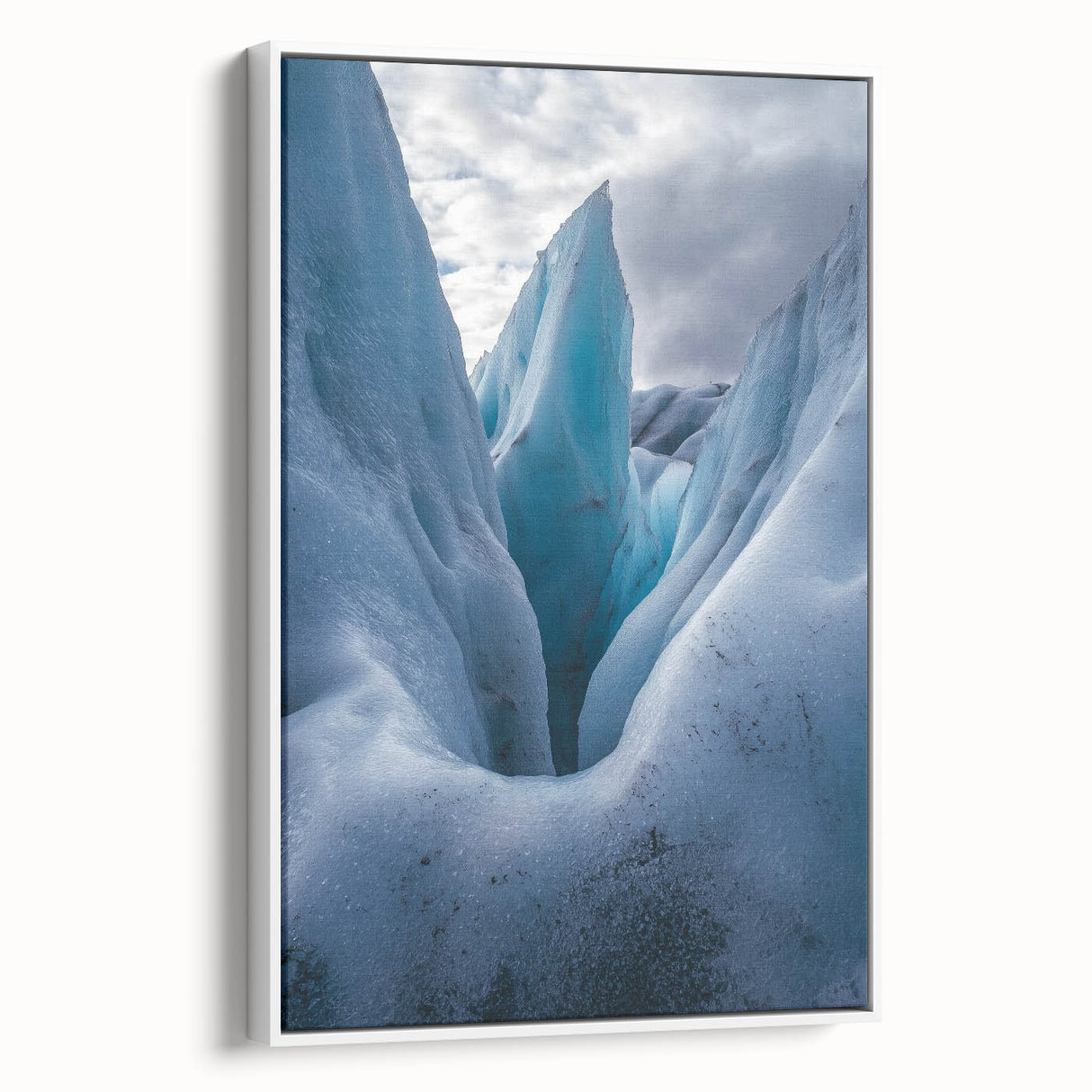 Framed canvas artwork showcasing a stunning landscape of cliffs, featuring vibrant colors and intricate details, displayed against a white background for a modern aesthetic.