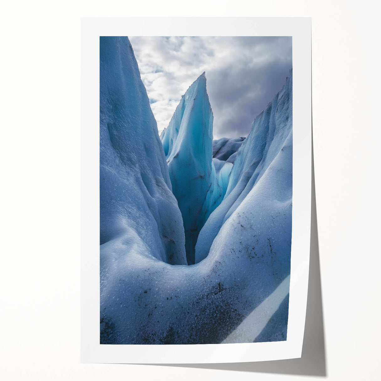Stunning landscape print showcasing dramatic cliffs against a vibrant sunset, rolled and securely packaged in a protective cardboard tube for easy display.