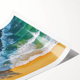 Vibrant landscape print showcasing a serene beach scene with soft waves and golden sand, rolled for easy transport and storage in a protective tube.