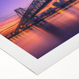 Rolled canvas print showcasing a vibrant landscape bridge design, featuring rich colors and intricate details, safely packaged in a protective cardboard tube. Perfect for home decor enthusiasts seeking unique artwork.