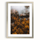 Textured abstract art print depicting autumnal hues on a framed canvas, suitable for bedroom decor.