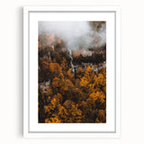 Abstract art print featuring swirling autumnal hues on a white framed canvas, suitable for bedroom or dining room decor.