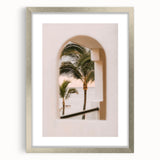 Textured abstract art print in vibrant orange and yellow hues, framed in silver, ideal for bedroom wall decor.