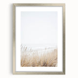 Textured abstract art print in muted earth tones on a framed canvas, suitable for bedroom ambiance.