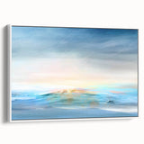 Framed abstract landscape wall art in soft pastel colors, showcasing serene hills and a cloudy sky, displayed from the side against a light background.