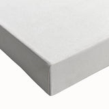 Large art of a black and white landscape painting on stretched canvas, featuring a detailed fruit arrangement.