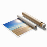 Colorful landscape beach scene rolled print showcasing vibrant blues and soft sandy tones, elegantly packaged in a protective cardboard tube, ideal for home decor.