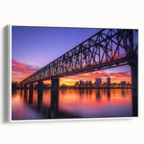 Framed canvas artwork of a scenic landscape bridge, showcasing intricate details and vibrant colors, set against a white background for modern decor.