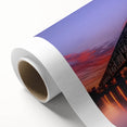 Landscape bridge design printed on rolled canvas, showcasing vibrant colors and intricate details, securely packaged in a protective cardboard tube for safe transport.