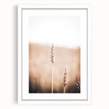 Abstract art print featuring swirling blue and white patterns on a framed canvas.