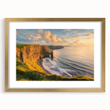 Framed landscape artwork depicting rugged cliffs and serene waters, featuring a gold mat border, perfect for enhancing any home decor with natural beauty.