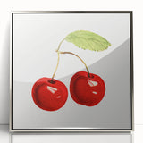 Mid-century modernist art featuring assorted fruits in vibrant colors on a silver-framed acrylic print.