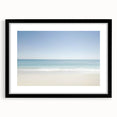 Black-framed landscape artwork featuring a serene beach scene with gentle waves and a clear blue sky, designed to enhance home decor and create a calming atmosphere.