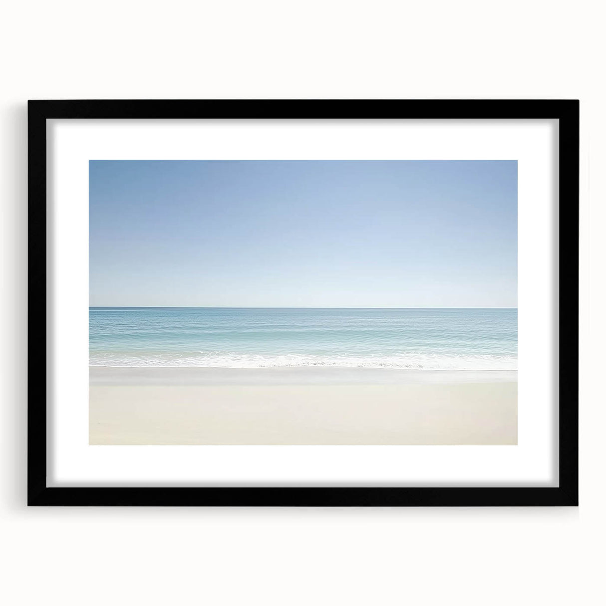 Black-framed landscape artwork featuring a serene beach scene with gentle waves and a clear blue sky, designed to enhance home decor and create a calming atmosphere.