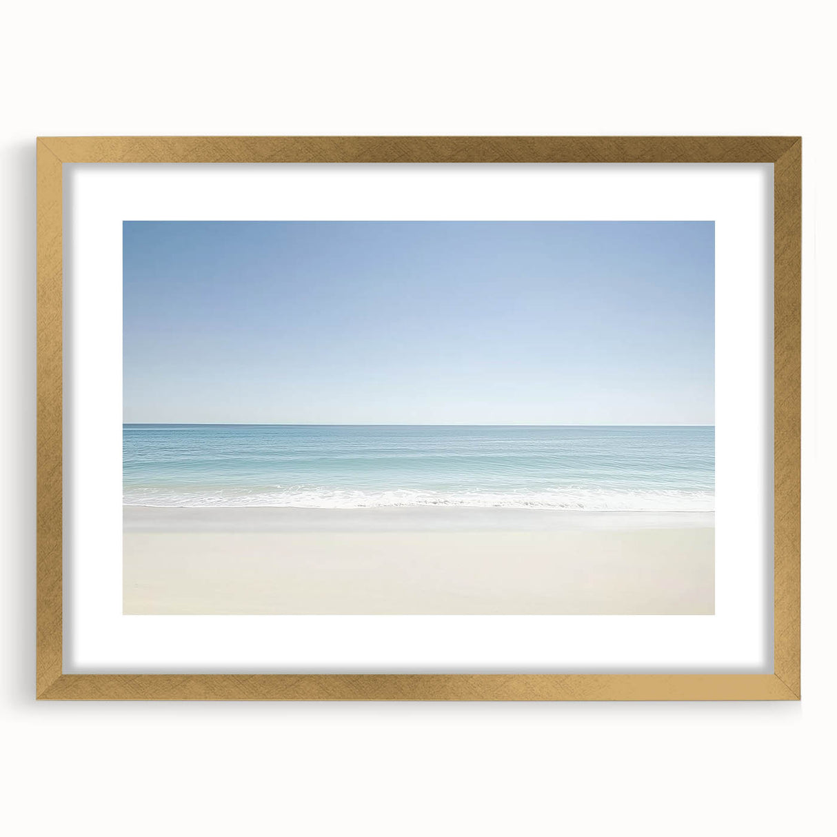 Gold-framed landscape print showcasing a serene beach scene, featuring soft waves and a clear sky, ideal for coastal home decor. Perfect for enhancing living spaces.