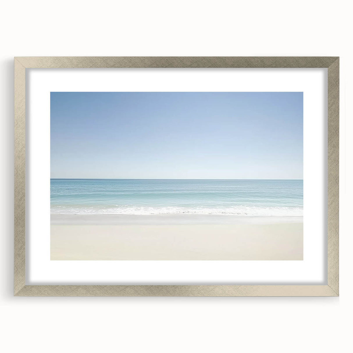 Framed landscape artwork showcasing a serene beach scene with a silver mat border, ideal for home decor. Perfect for adding a coastal touch to interiors.