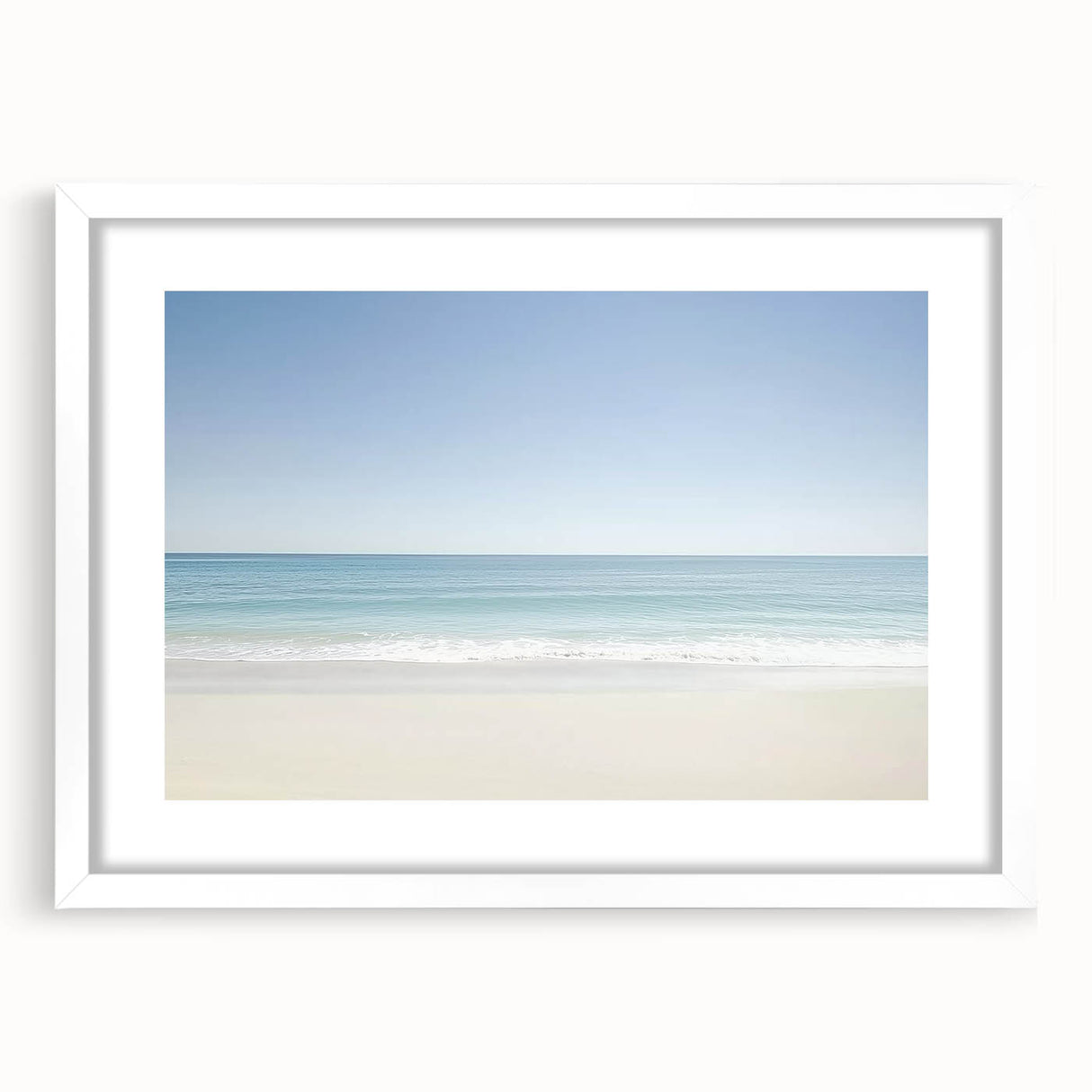 Landscape beach artwork framed in white, showcasing serene ocean waves and sandy shores, perfect for coastal home decor or beach-themed interiors.