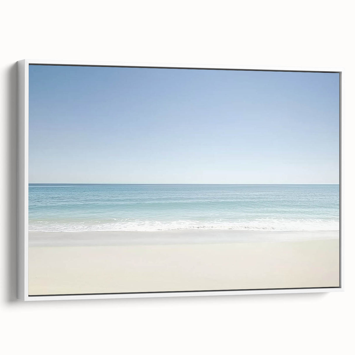 Framed landscape canvas artwork depicting serene beach scenery with gentle waves and soft white sand, showcasing a side view of its elegant design.
