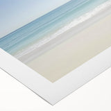 Vibrant rolled canvas artwork depicting a serene beach landscape with golden sands and turquoise waves, designed for home decor, packaged securely in a sturdy tube.