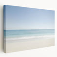 Stretched canvas artwork depicting a serene beach landscape with vibrant blue skies and golden sands, ideal for coastal home decor. Perfect for adding a tranquil touch to living spaces.
