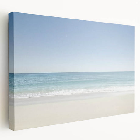 Stretched canvas artwork depicting a serene beach landscape with vibrant blue skies and golden sands, ideal for coastal home decor. Perfect for adding a tranquil touch to living spaces.